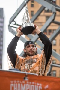 Madison Bumgarner holding the SF Giants' World Series Trophy (photo by Sierra Hartman)